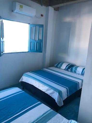 Postel nebo postele na pokoji v ubytování Casa Santorini