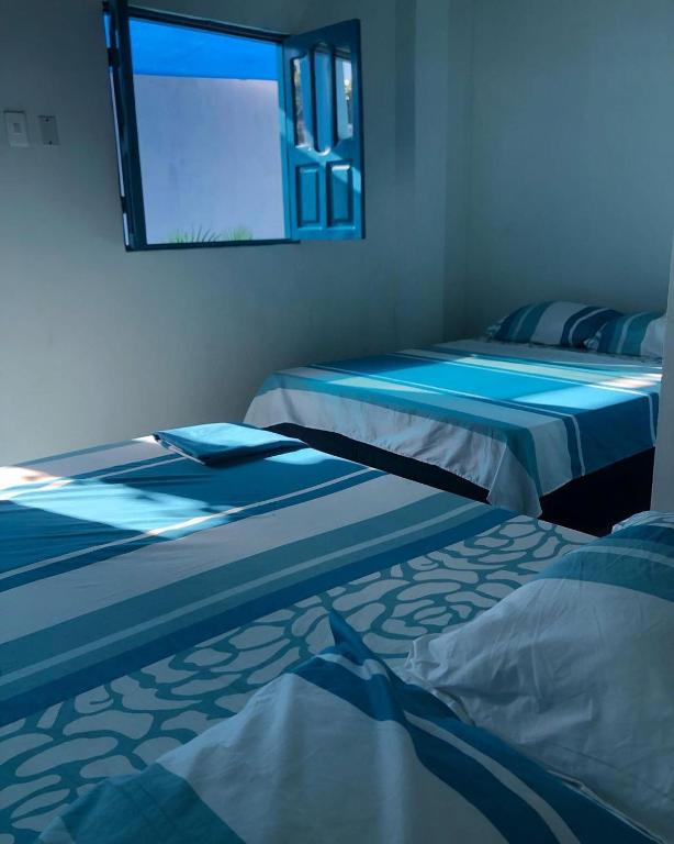 Postel nebo postele na pokoji v ubytování Casa Santorini