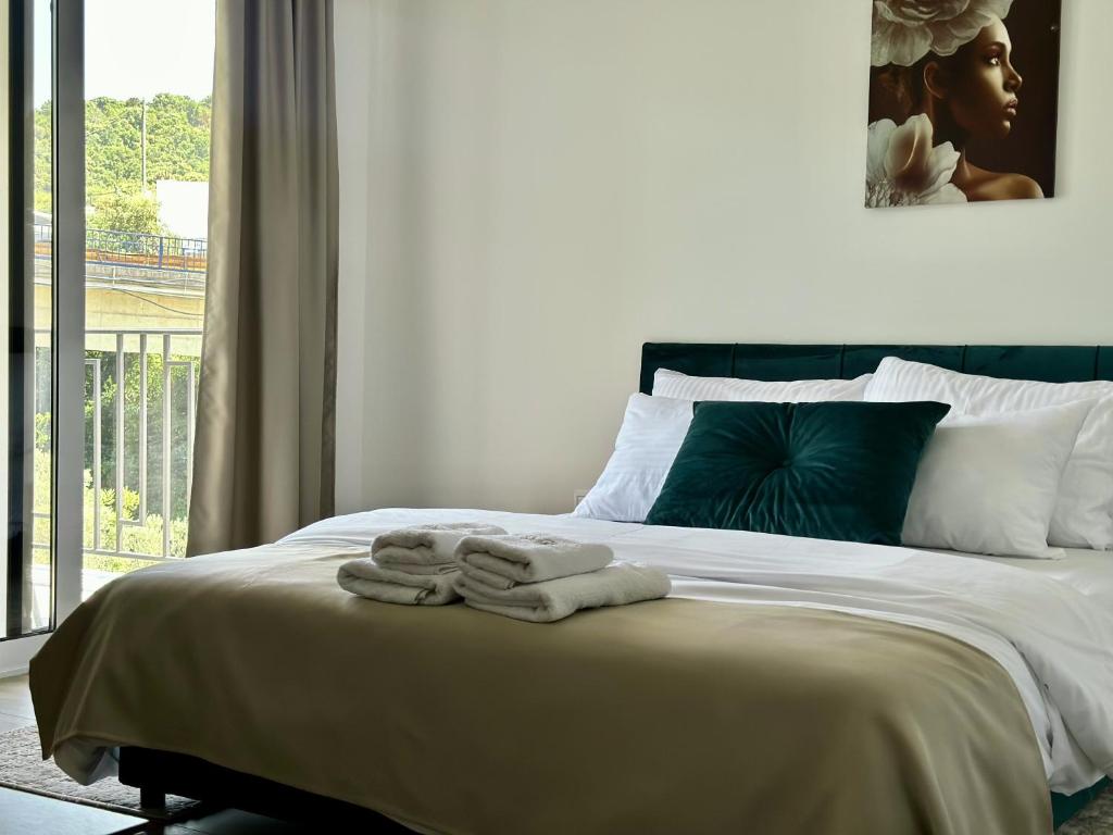 Postel nebo postele na pokoji v ubytování Akhdar Apartments