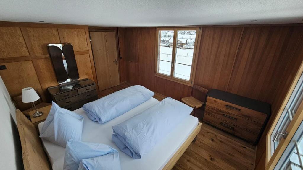 Postel nebo postele na pokoji v ubytování Chalet Bärgsunne