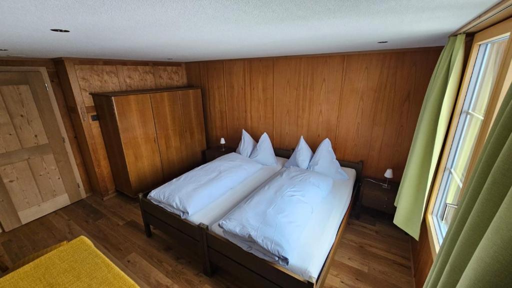 Postel nebo postele na pokoji v ubytování Chalet Bärgsunne
