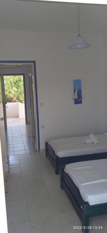 Postel nebo postele na pokoji v ubytování Lemonis House
