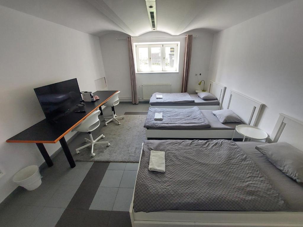Postel nebo postele na pokoji v ubytování ROSE house - greenline accomodations