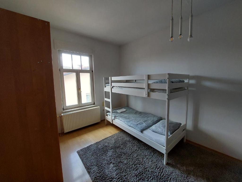 Postel nebo postele na pokoji v ubytování ROSE house - greenline accomodations