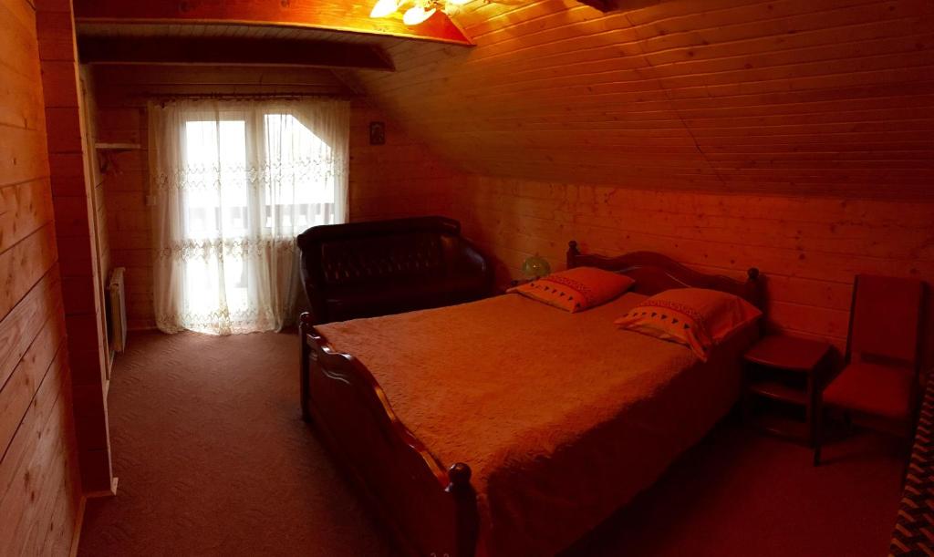 Postel nebo postele na pokoji v ubytování Villa PidStromom