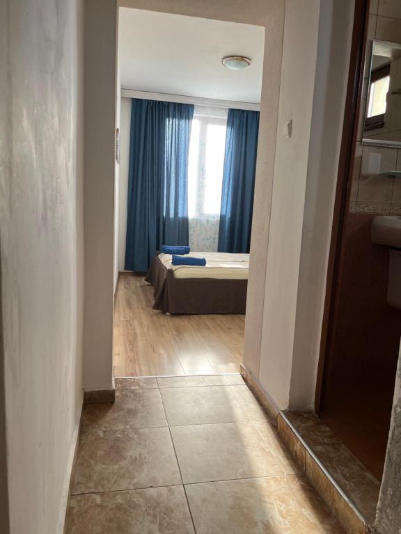 A bed or beds in a room at Paunovi Guest House