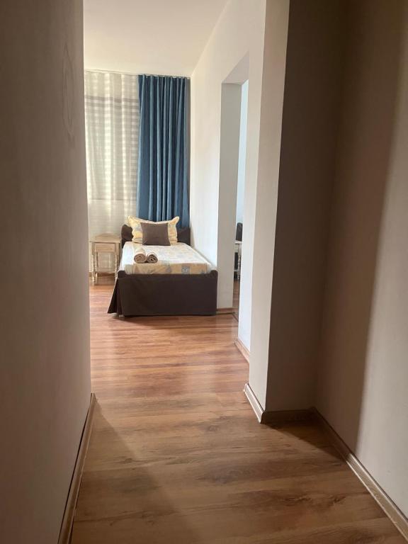 A bed or beds in a room at Paunovi Guest House