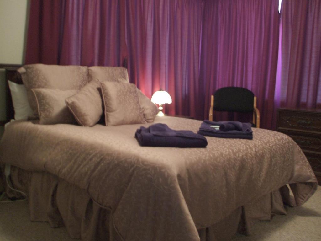 Ліжко або ліжка в номері Panorama Motor Inn
