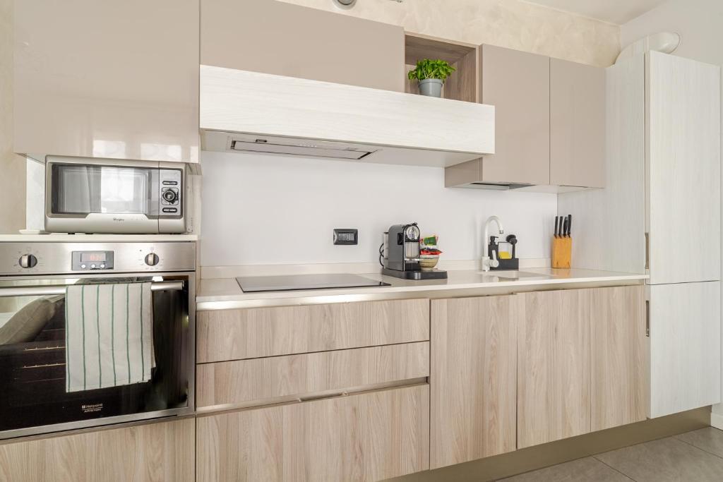 Kuchyň nebo kuchyňský kout v ubytování Dalmine Luxury Suite
