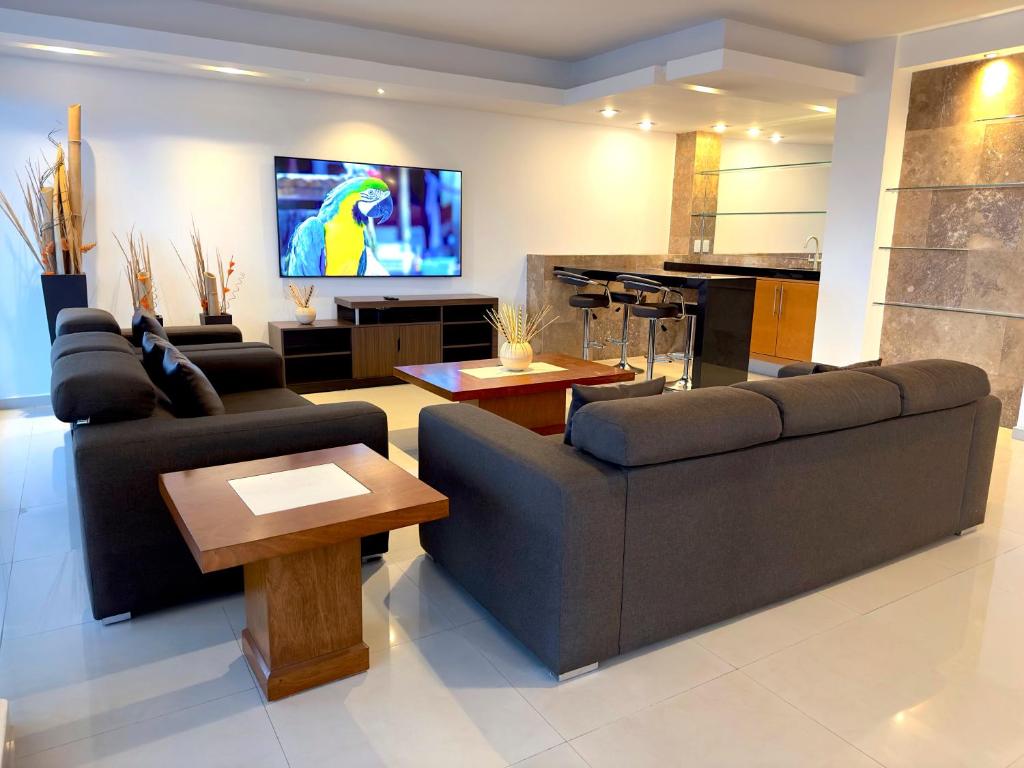 TV a/nebo společenská místnost v ubytování Topacio7 Residencial