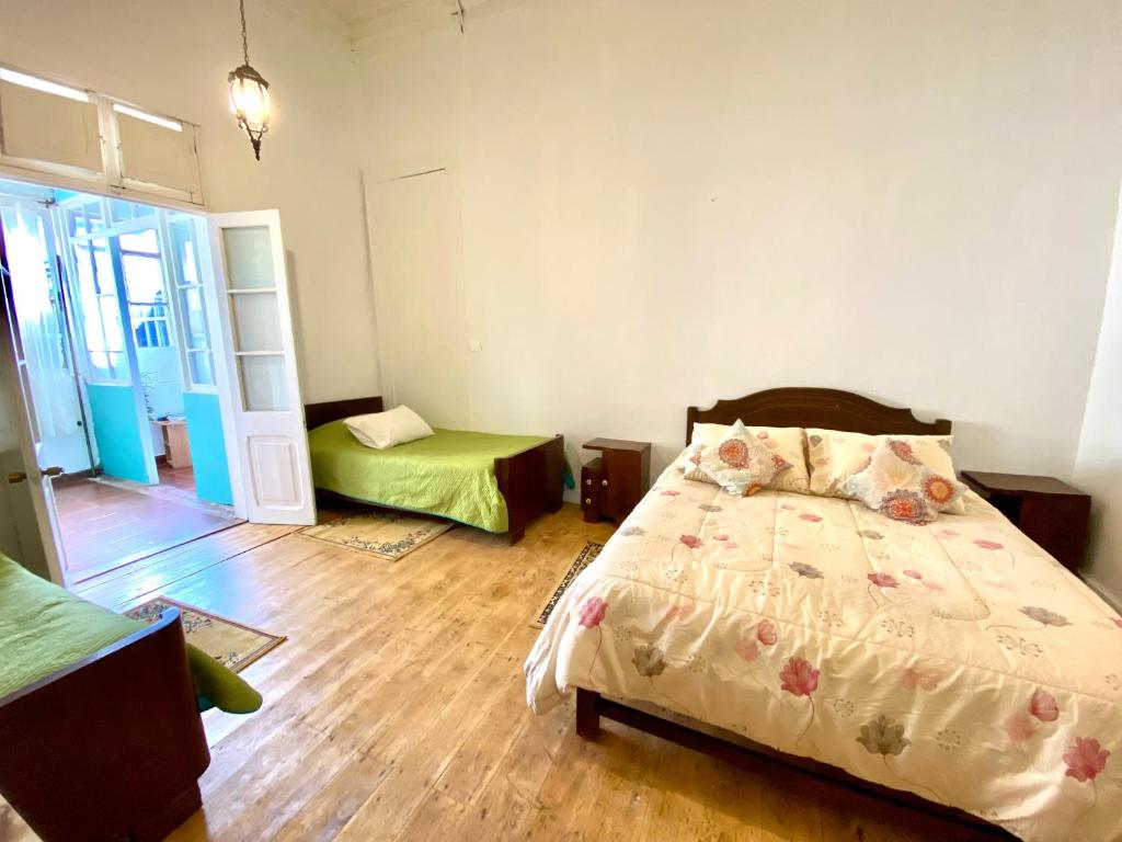 Postel nebo postele na pokoji v ubytování Hotel Dolegant