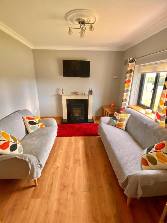 Postel nebo postele na pokoji v ubytování Paddys Cottage