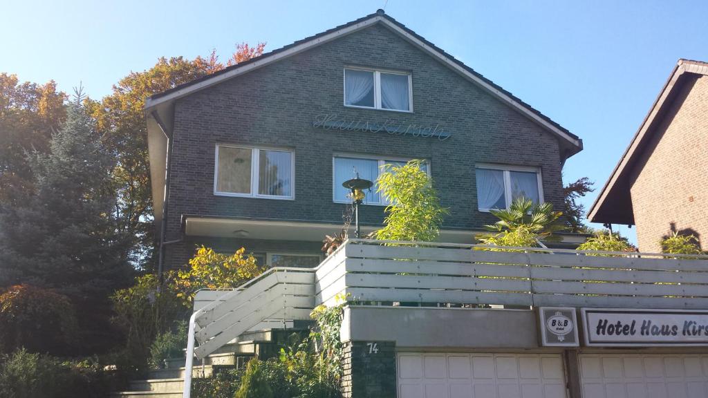 a house with a fence in front of it at Hotel Haus Kirsch in Grevenbroich