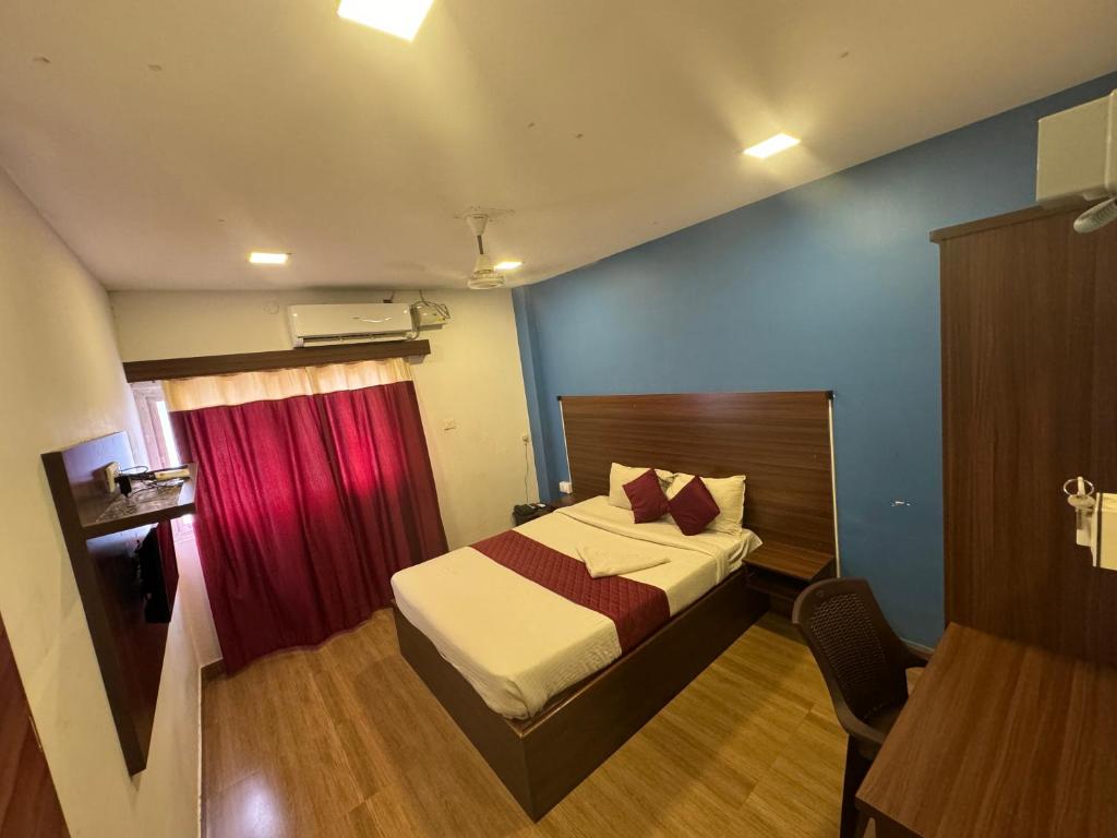 Postel nebo postele na pokoji v ubytování Hotel New Cresent park
