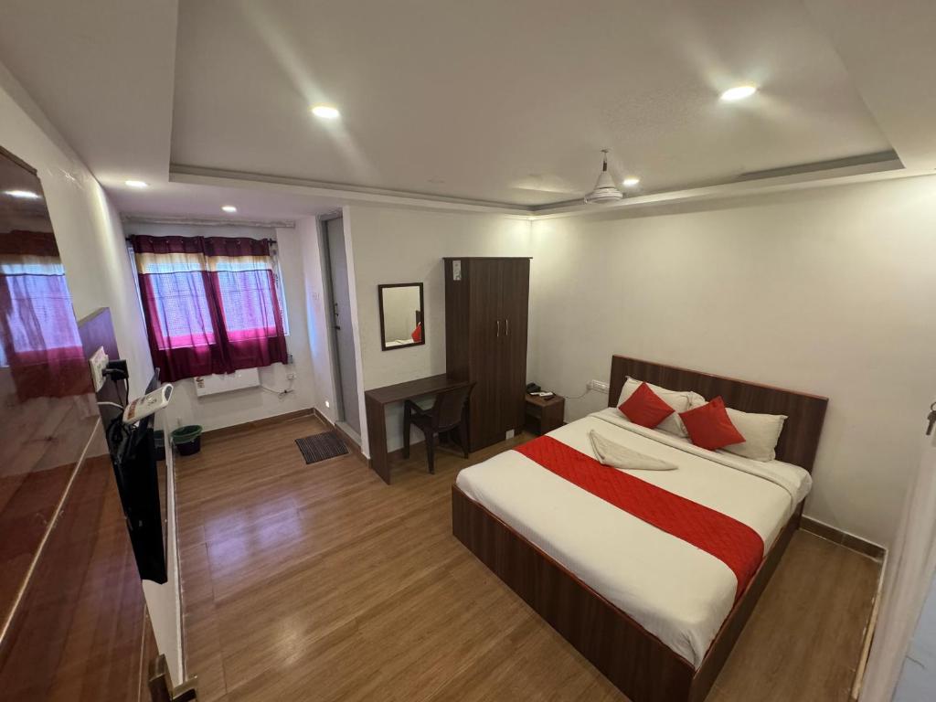 Postel nebo postele na pokoji v ubytování Hotel New Cresent park