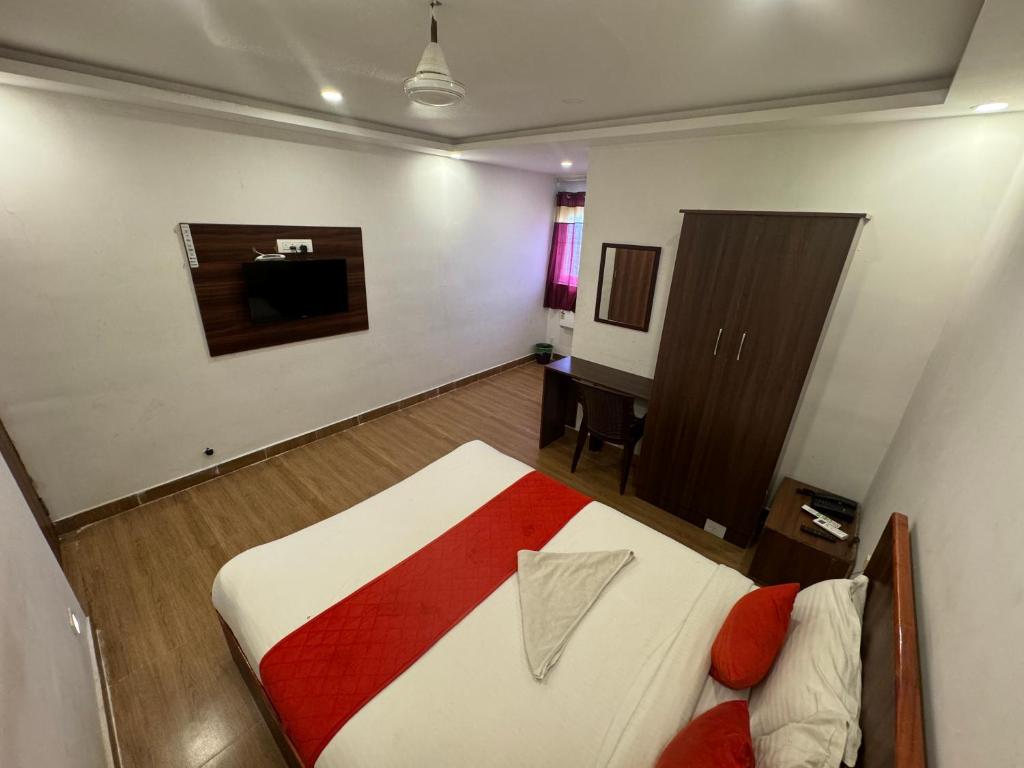 Postel nebo postele na pokoji v ubytování Hotel New Cresent park