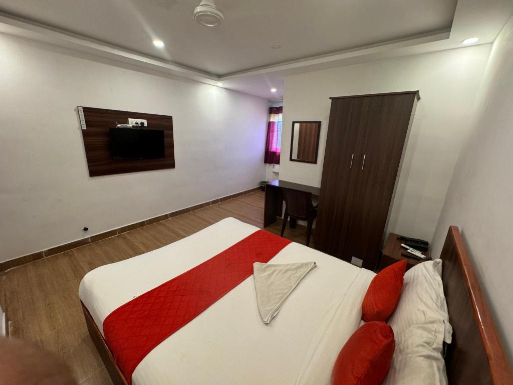 Postel nebo postele na pokoji v ubytování Hotel New Cresent park