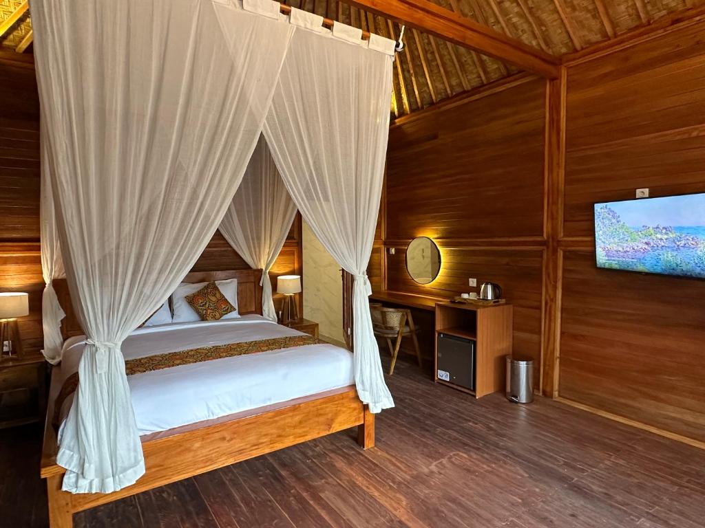 Postel nebo postele na pokoji v ubytování Uma Swari Villa Sidemen