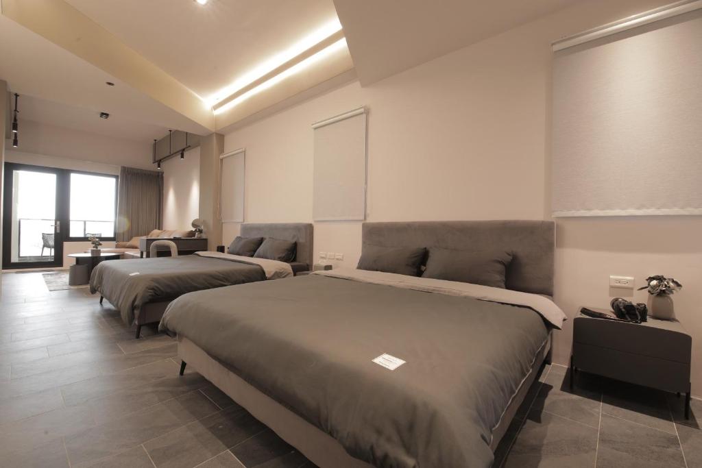 Postel nebo postele na pokoji v ubytování 沒有名字Unnamed B&B