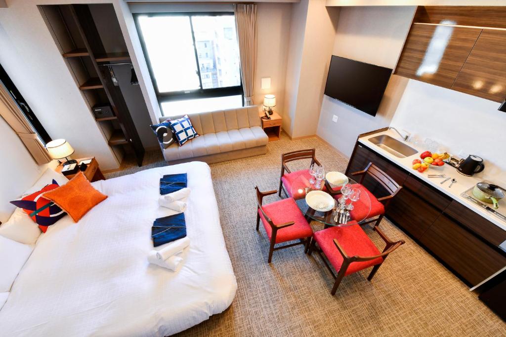 Postel nebo postele na pokoji v ubytování ENT TERRACE AKIHABARA