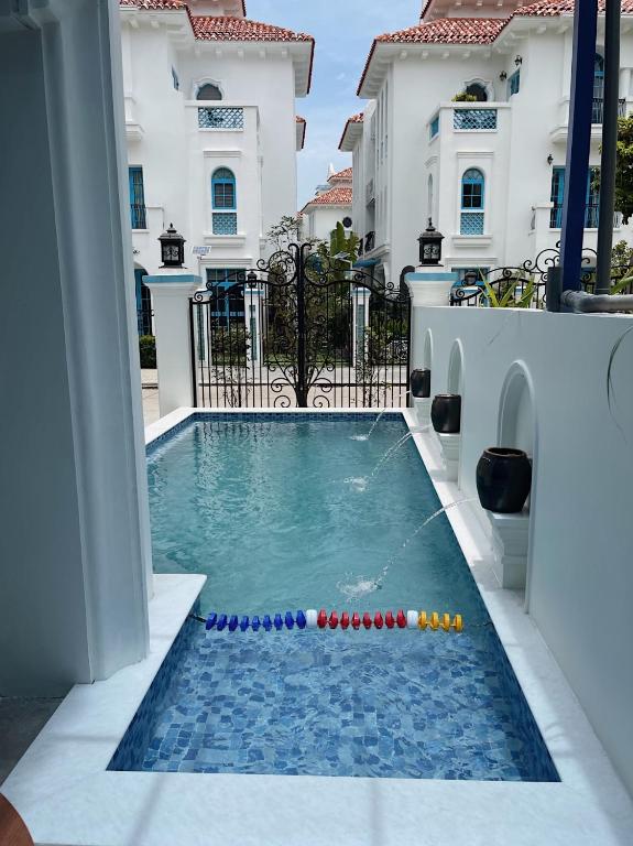 a pool with a bunch of cue balls in it at Spacious 6BR Villa Near Beach in Ha Long