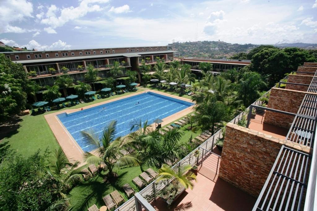 an aerial view of a building with a swimming pool at Kabira Country Club in Kampala