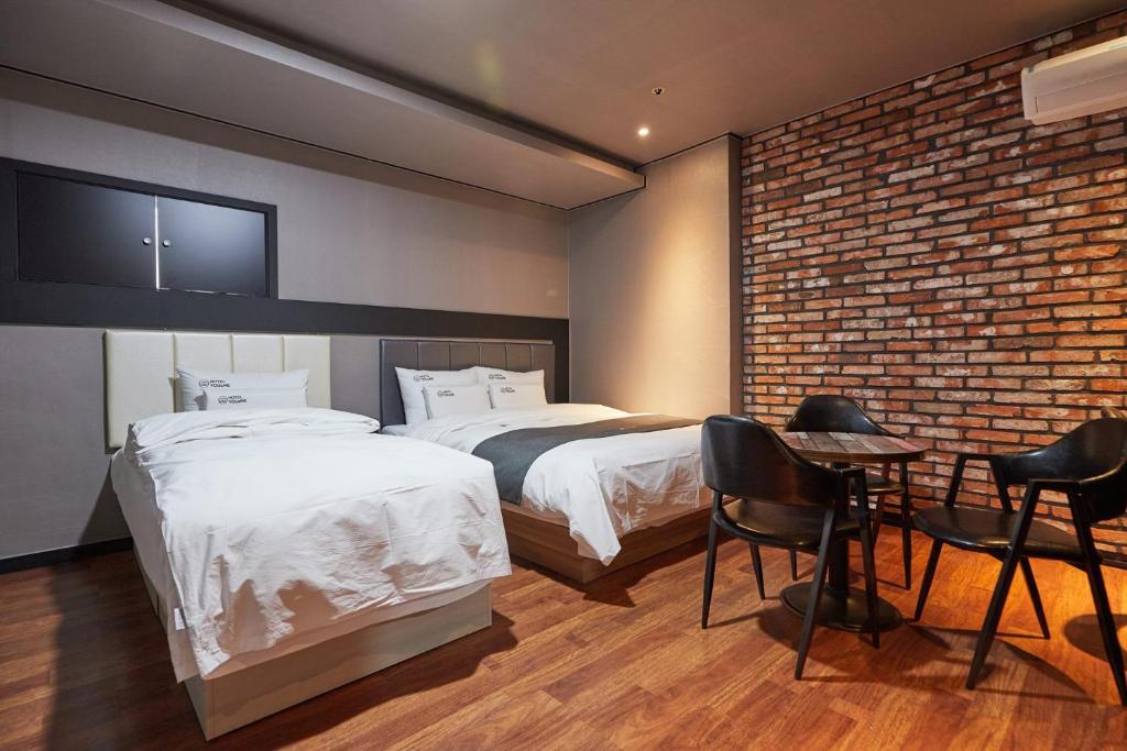 Postel nebo postele na pokoji v ubytování You&Me Hotel
