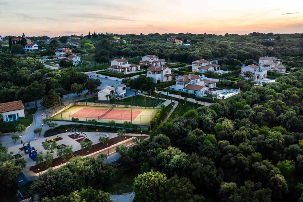 an aerial view of a tennis court in a town at Mirana Luxury Villas in Kavran