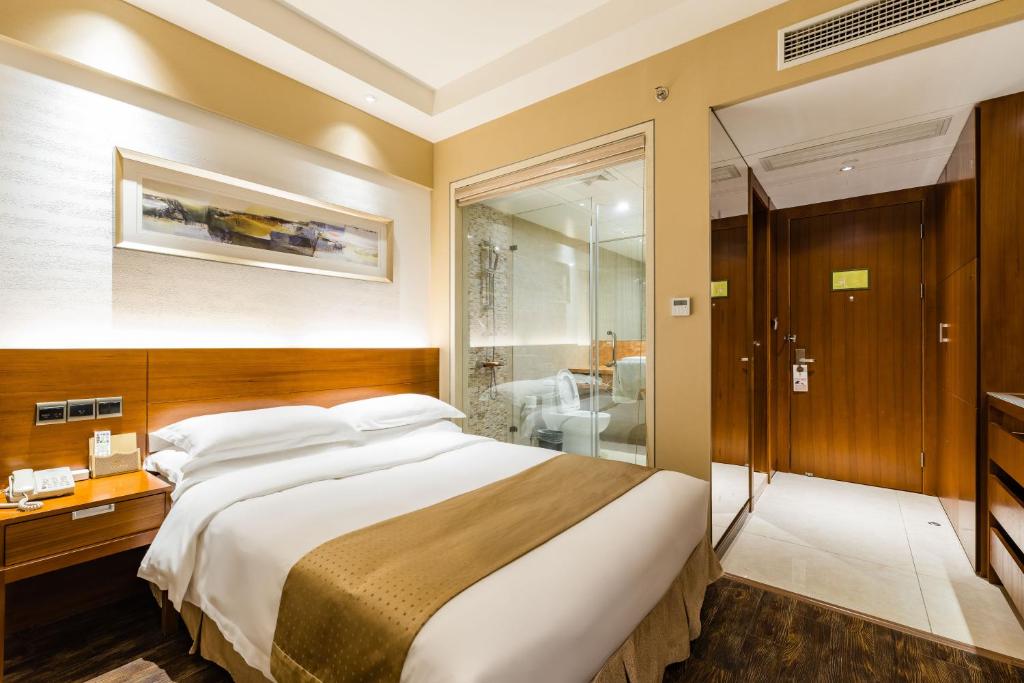 Postel nebo postele na pokoji v ubytování Maixinge Boutique Hotel Chuansha Branch