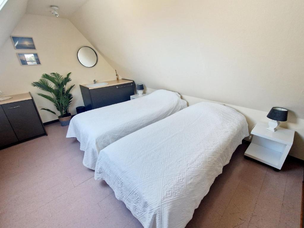Postel nebo postele na pokoji v ubytování Huize Mares