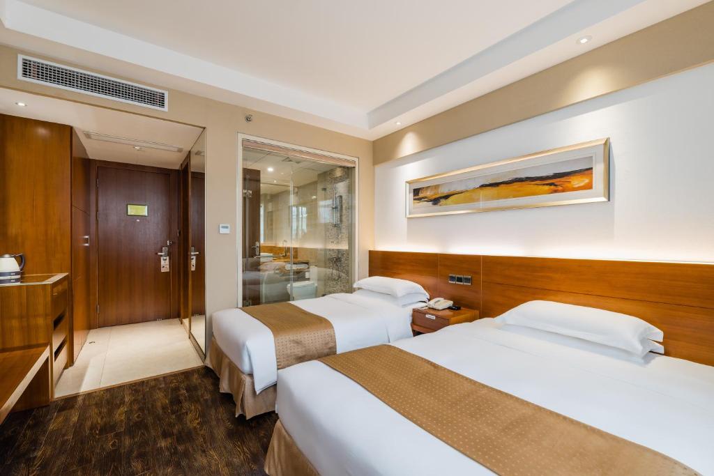 Postel nebo postele na pokoji v ubytování Maixinge Boutique Hotel Chuansha Branch