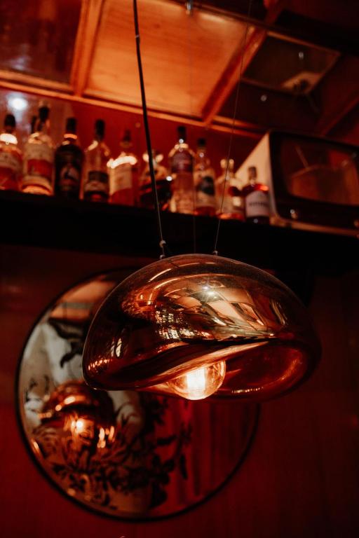 a glass light hanging from a ceiling at Hotel Lux in Munich