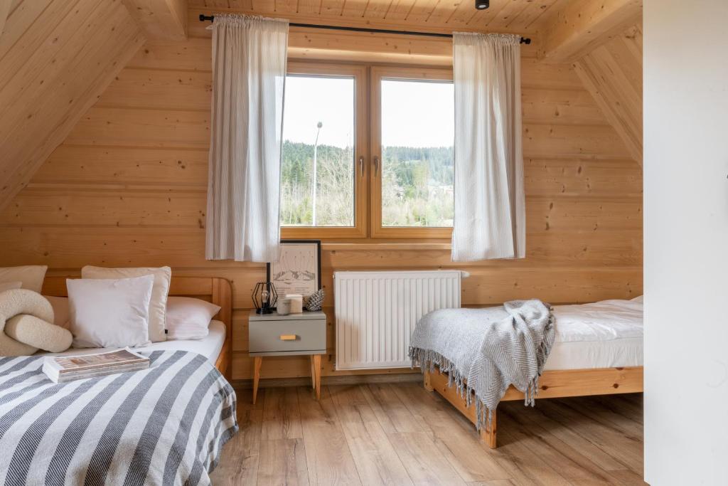 Posteľ alebo postele v izbe v ubytovaní Domek Pana Jana