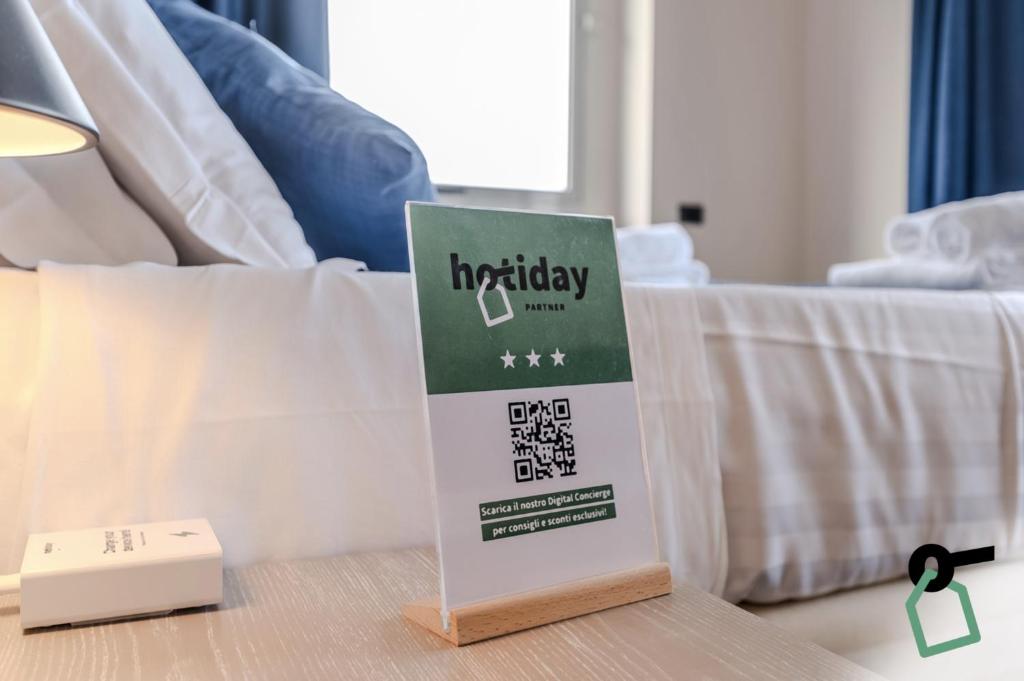 Postel nebo postele na pokoji v ubytování Hotiday Room Collection - Stresa