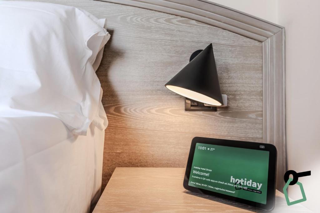 Postel nebo postele na pokoji v ubytování Hotiday Room Collection - Stresa