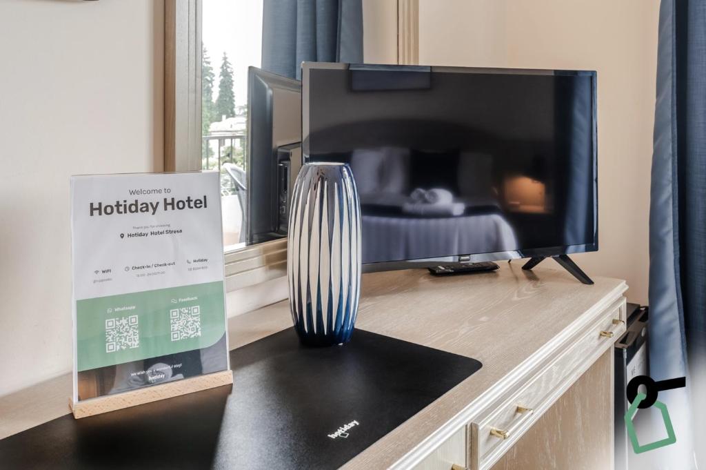 TV a/nebo společenská místnost v ubytování Hotiday Room Collection - Stresa