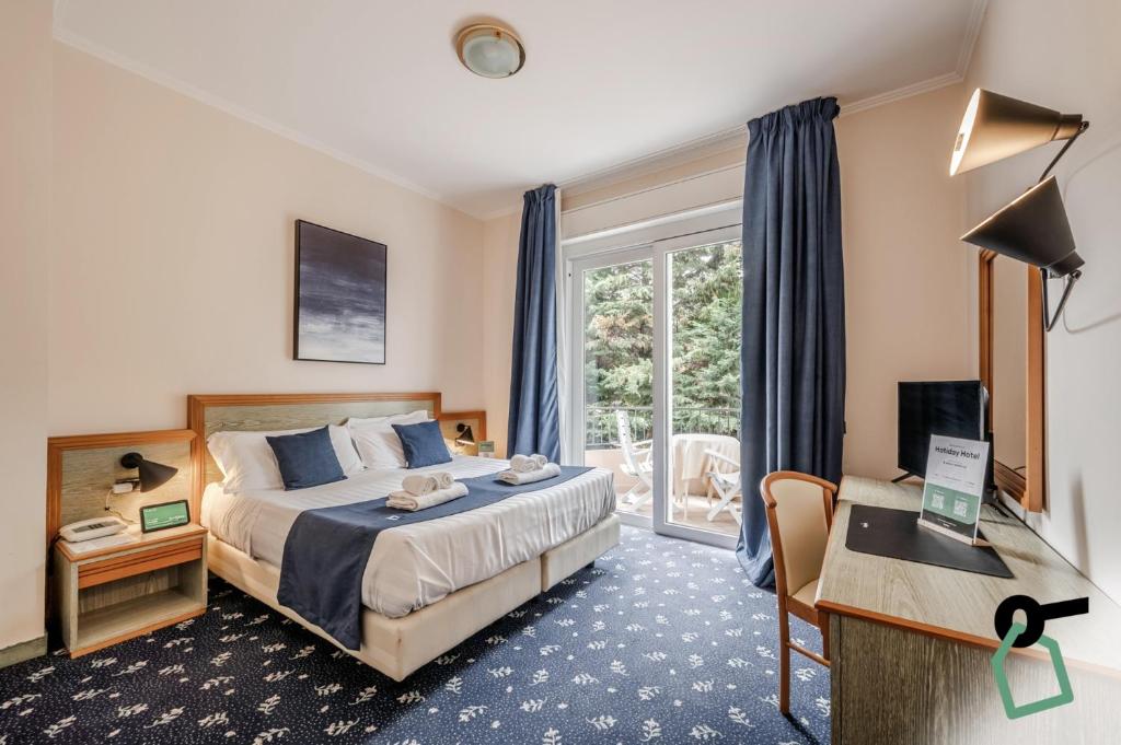 TV a/nebo společenská místnost v ubytování Hotiday Room Collection - Stresa