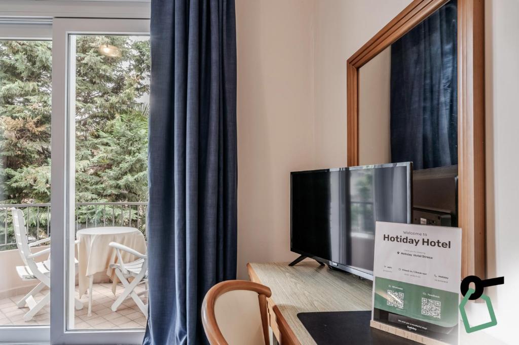 TV a/nebo společenská místnost v ubytování Hotiday Room Collection - Stresa