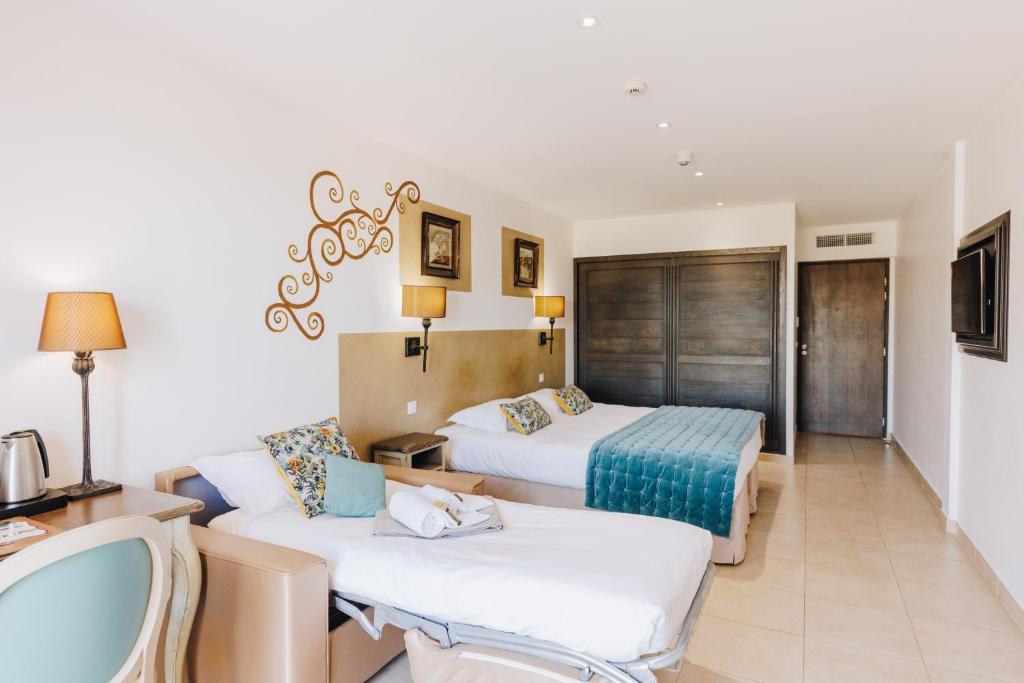 Posezení v ubytování Hôtel Liberata & Spa
