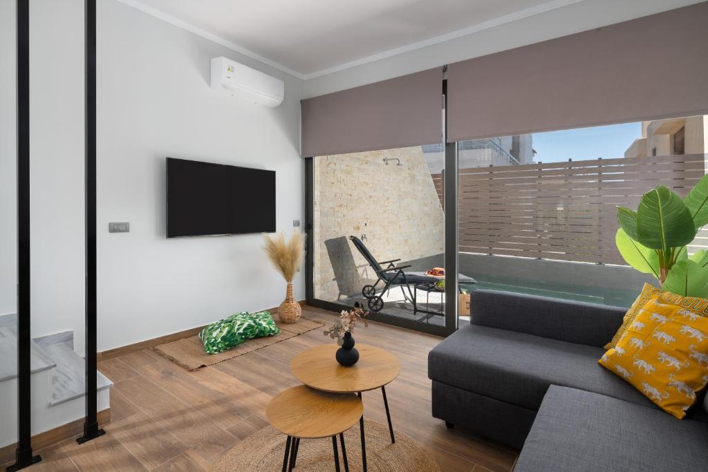 Télévision ou salle de divertissement dans l'établissement La Siesta Villas
