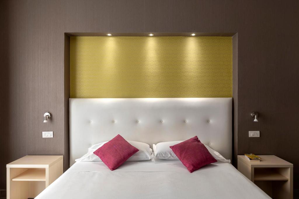 Postel nebo postele na pokoji v ubytování Napolit'amo Hotel Medina