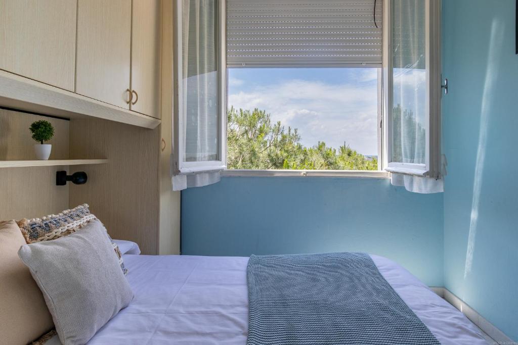 Postel nebo postele na pokoji v ubytování Lido degli Estensi Flat a due passi dalla spiaggia