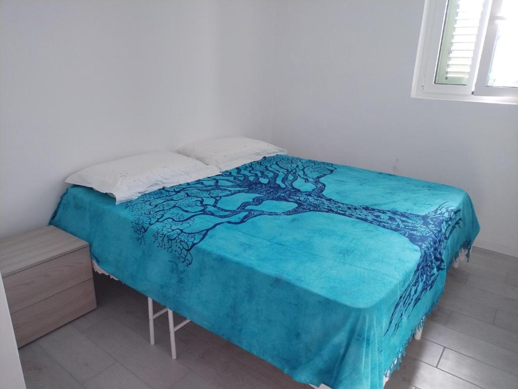 Postel nebo postele na pokoji v ubytování Casa vacanze Dimo Dimira-PUGLIA E SALENTO