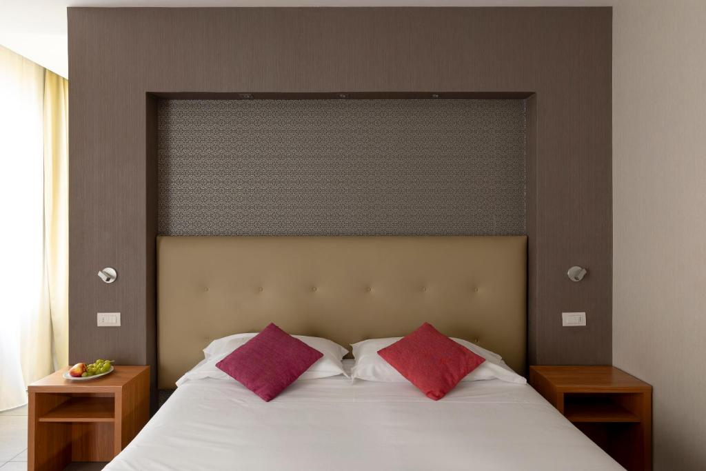 Postel nebo postele na pokoji v ubytování Napolit'amo Hotel Medina