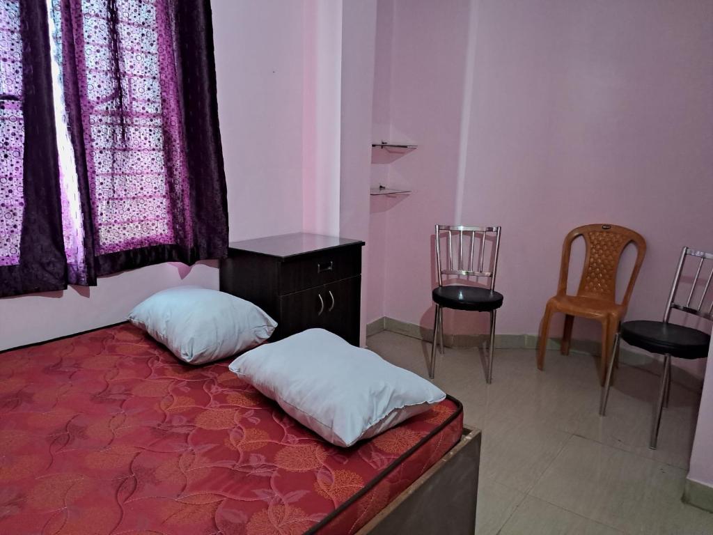 Postel nebo postele na pokoji v ubytování S.S. GUEST HOUSE