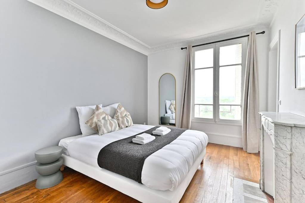 Postel nebo postele na pokoji v ubytování Appartement Vue panoramique sur la capitale