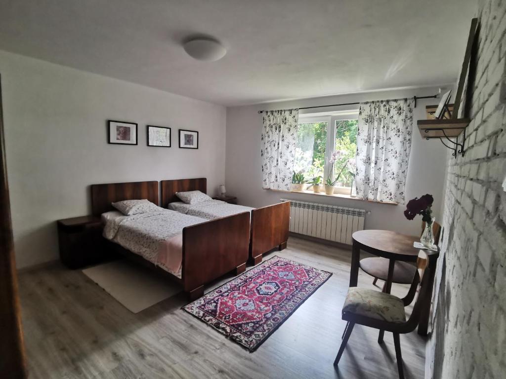 Postel nebo postele na pokoji v ubytování Siedlisko pod Orzechem