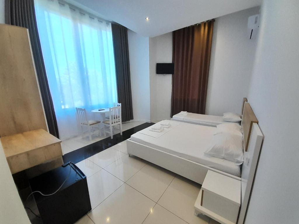 Postel nebo postele na pokoji v ubytování Hotel Restaurant Univers