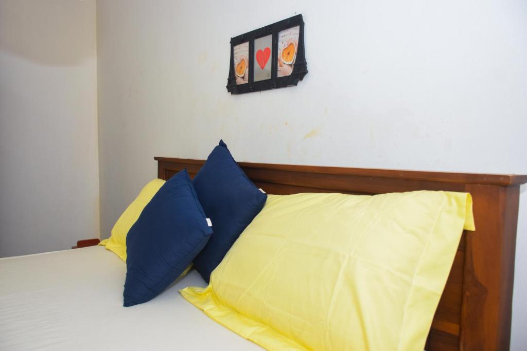 Postel nebo postele na pokoji v ubytování Senu Homestay