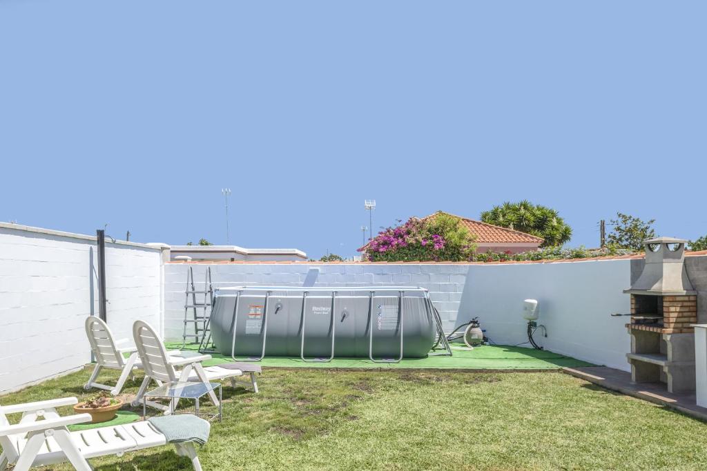 Zahrada ubytování Villa Chani - Sólo familias